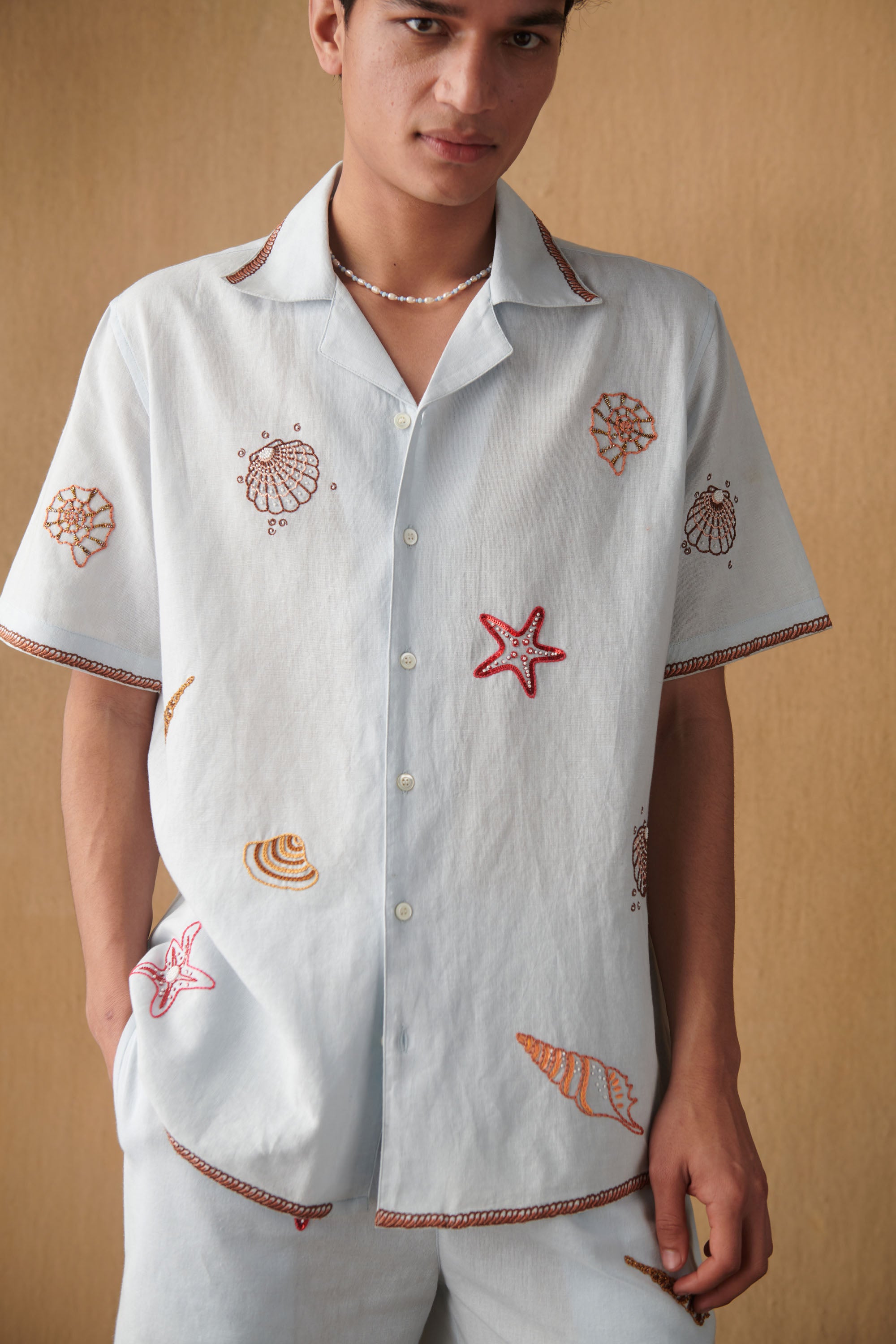 Cotton Linen Half Sleeves Summer Shirt With Hand Embroidered Seashells Perfect For Resort & Vacation Wear By Perte d'ego Cotton Linen Half Sleeves Summer Shirt With Hand Embroidered Seashells Perfect For Resort & Vacation Wear By Perte d'ego